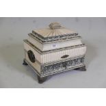 A C19th Vizagapatam ivory workbox, the shaped top opening to reveal an interior with fitted
