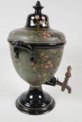 A C19th Russian pottery tea urn, with embossed floral decoration, 15" high