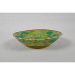 A yellow ground porcelain dish with frilled rim and incised green dragon decoration, Chinese