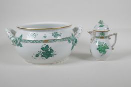 A Herend porcelain, with green Chinese bouquet pattern, two handled pot. And milk jug. AF. Largest