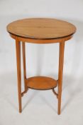 A Sheraton style satinwood two tier occassional table, with shell & string inlay. On square