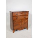 George III mahogany commode with two long drawers over two cupboard doors, raised on shaped