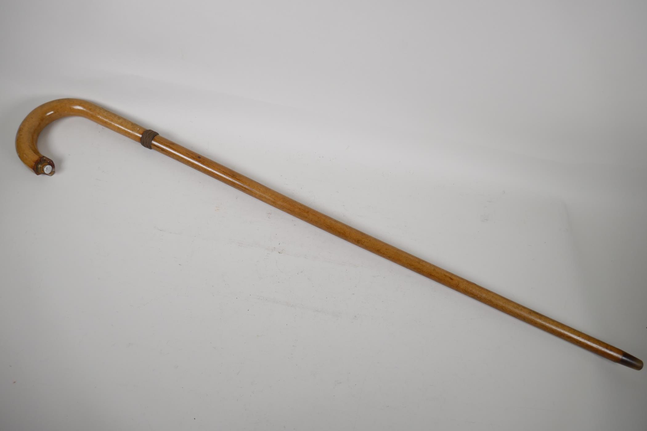 A spiral decorated walking stick, with bone handle. 37" long
