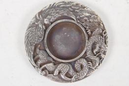 A Chinese white metal ink stand with dragon & phoenix decoration, 3¼" diameter