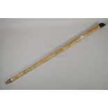 An oriental, faux bone sectional walking stick, with engraved decoration, AF, loss to handle &