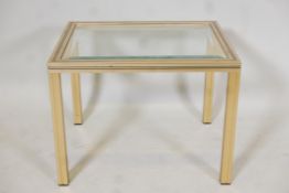 A gilt metal and glass occassional table, by Pierre Vandell, Paris. 15" x 19½" x 16"