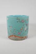 A Chinese polychrome porcelain brush pot decorated with birds amongst flowers, seal mark to base,
