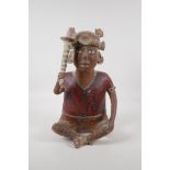 An antique south American Nayarit tribal terracotta seated figure, carrying a sceptre/club. With