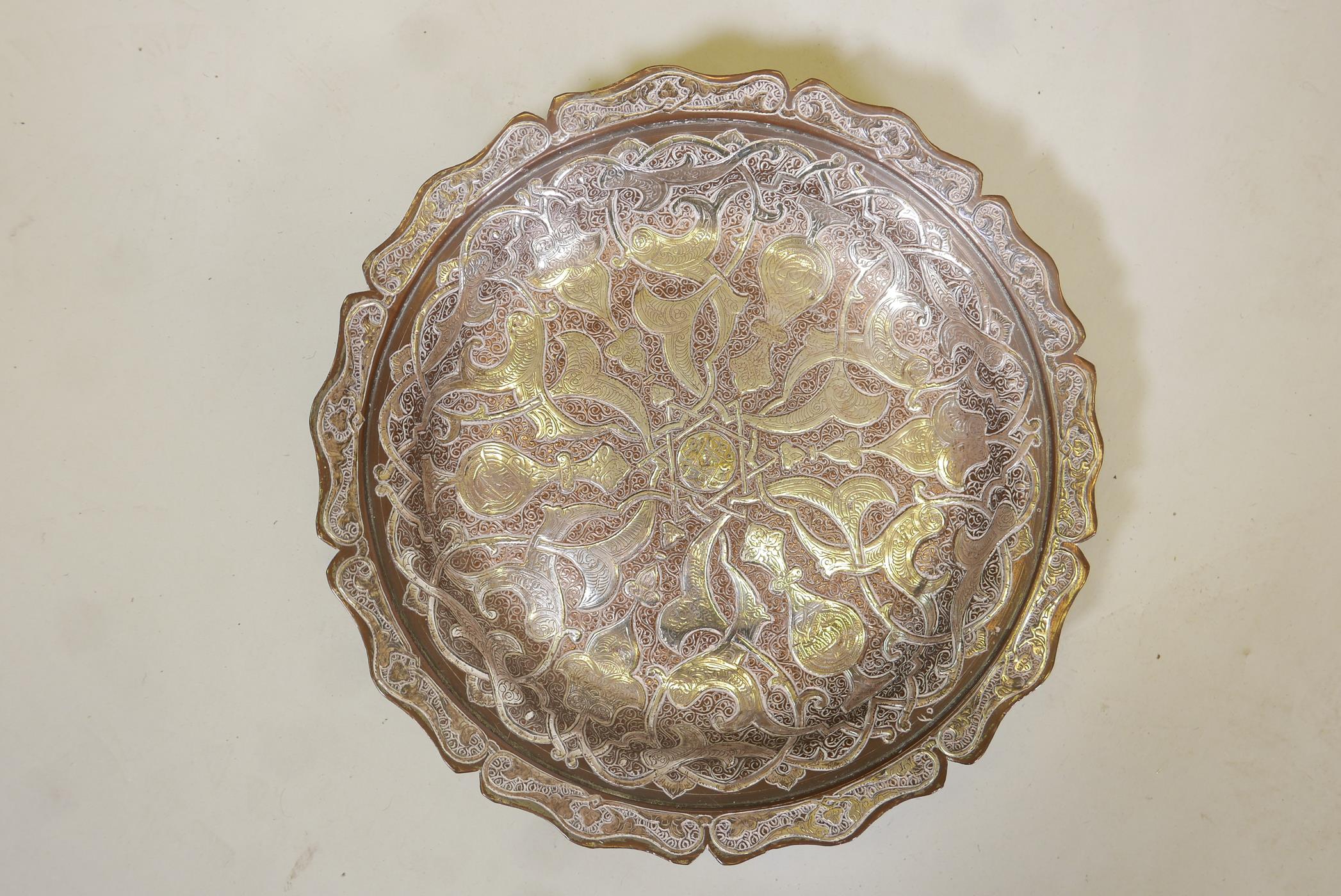 A good Islamic copper bowl, with raised & inlaid silver, engraved with calligraphy, 11" diameter
