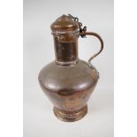 A large Eastern copper flagon and cover, 17" high