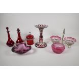 A collection of C19/20th Ruby & Cranberry glass. Including a lustre, perfume bottles, pots,