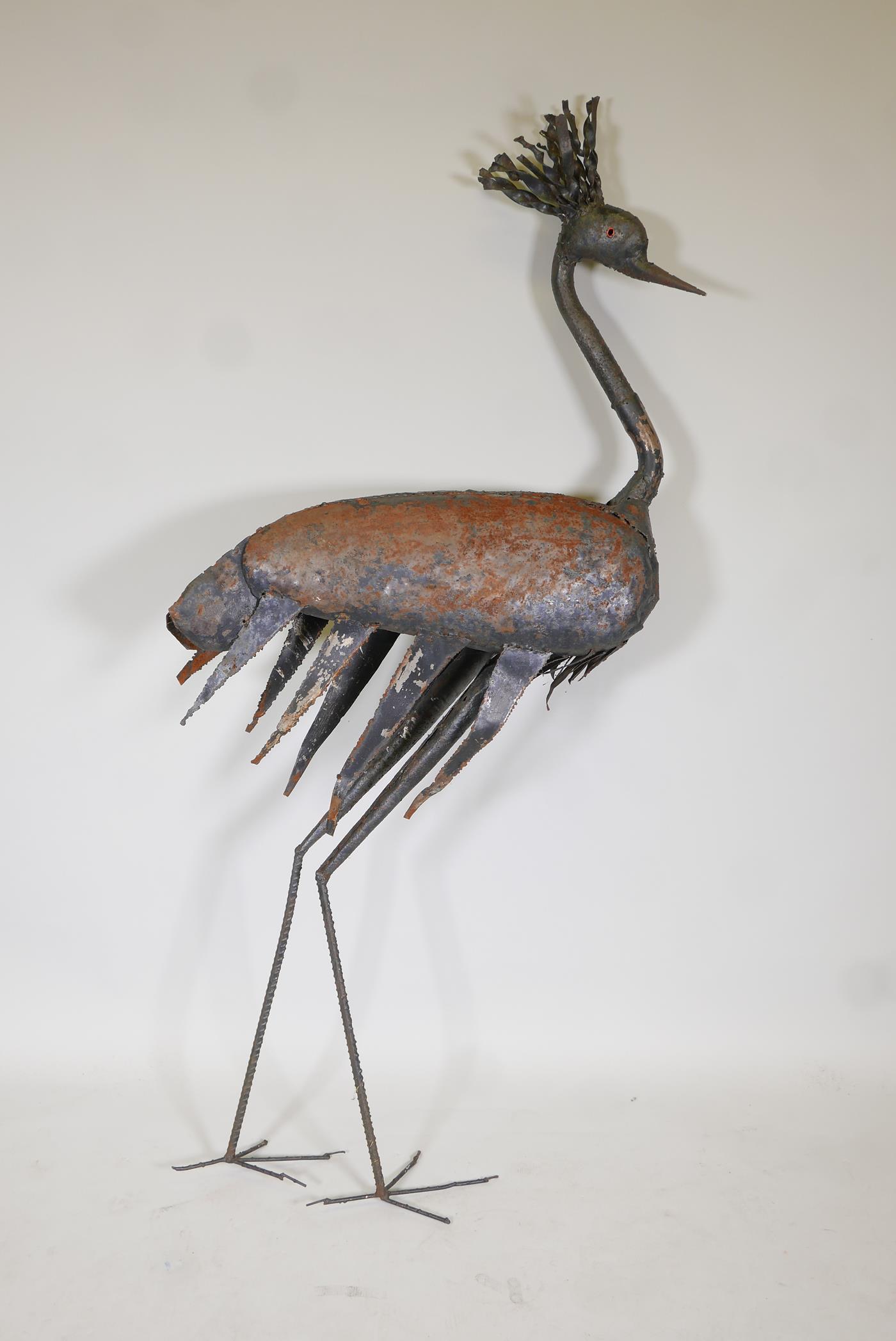 A painted iron sculpture of an emu, 63" high