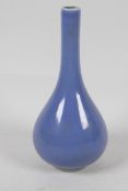 A blue glazed Chinese porcelain long necked specimen vase, with seal mark to base. 6" high