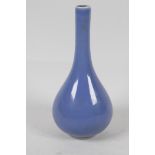 A blue glazed Chinese porcelain long necked specimen vase, with seal mark to base. 6" high