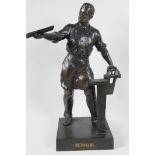 A bronze figure of a metal worker, 16" high