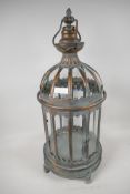 A copper plated metal and glass cylindrical garden lantern. 24" high