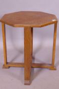 An early C20th Arts & Crafts octagonal top oak occasional table, raised on four square supports