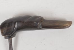 A C19th carved horn walking stick handle, carved as a greyhounds head. 4½" long