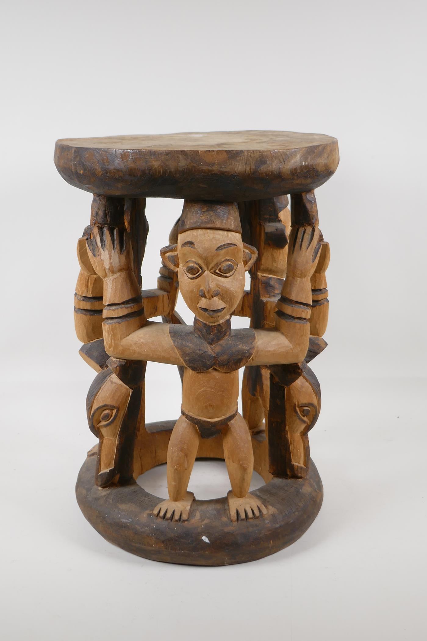 An African carved & stained wood figural stool. 16½" high x 12" diameter - Image 2 of 4