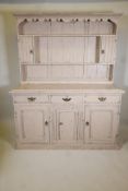 A C19th painted oak dresser in two sections, with three drawers over three fielded panel doors.