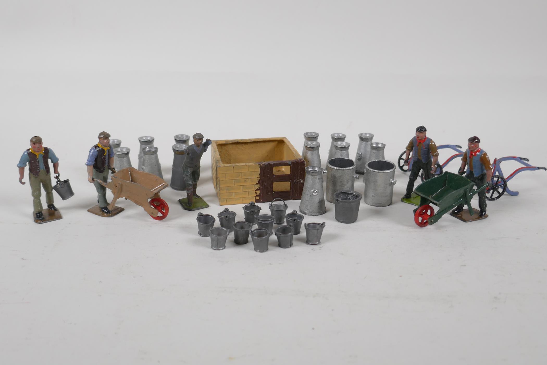 A collection of Britains, painted lead agricultural figures & milk churns, etc. AF