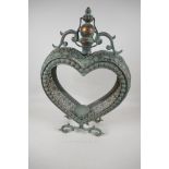 A heart shaped pierced metal & glass garden candle lantern, 21" high