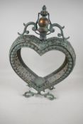 A heart shaped pierced metal & glass garden candle lantern, 21" high