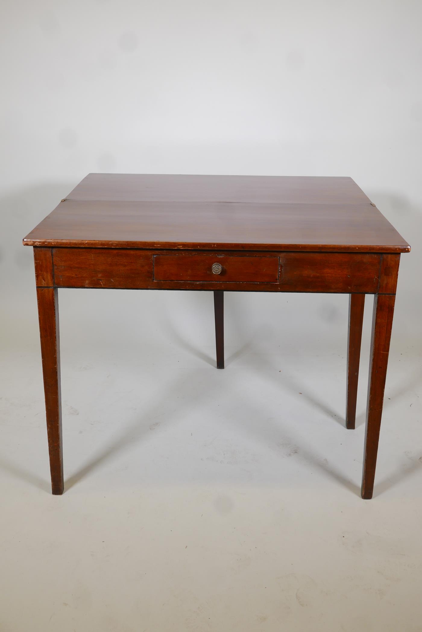 A Georgian III mark tea table with a fold over top and a single drawer, raised on square tapering - Image 2 of 4