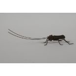 A Japanese Jizai style bronze of a grasshopper, with articulated limbs & antennae, 6" long