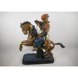 A large gold painted brass figure of an Arab tribesman, riding a horse, 24" high