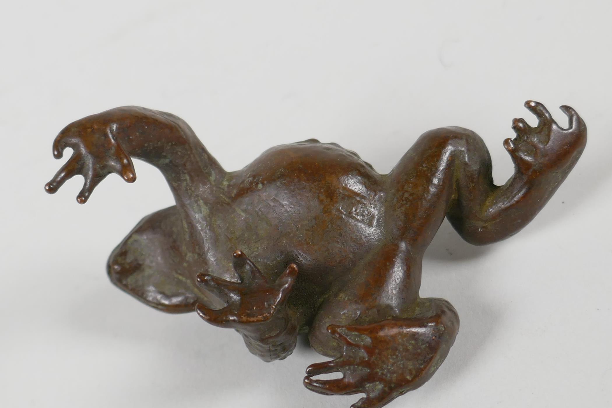 A Japanese bronze okimono in the form of a toad, indistinct impressed mark to base, 3" long - Image 3 of 3