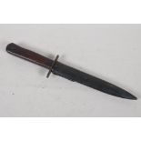 A replica military dagger in a metal sheath. 12" long