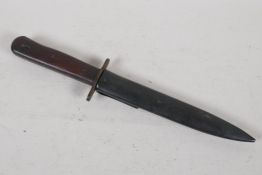 A replica military dagger in a metal sheath. 12" long