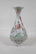 A Chinese ming style porcelain pear shaped vase of octagonal form with red and green decoration of