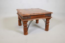 A fruitwood coffee table with iron mounts. 24" x 24" x 16" high