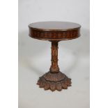 An Italian style occassional table with decorated circular top, on a moulded leaf form pedestal