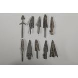 Ten Archaic style bronze arrowheads, 3" largest