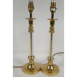 A pair of brass and glass column table lamps, 16" high