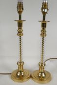 A pair of brass and glass column table lamps, 16" high