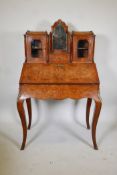 A Victorian inlaid, figured and burr walnut bonne-heure-de jour, with a brass galleried top and