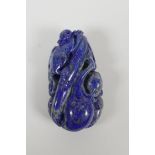 A Chinese carved lapis pendant/ornament, depicting a monkey on bamboo with gourds. 3" long