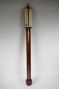 A replica mercury stick barometer in a mahogany case from Comitti of London, with instructions