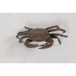 A small Jizi style bronze figurine of a crab, 2" wide