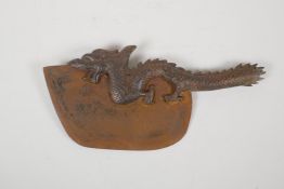 A decorative Chinese bronze handled chopper in the form of a dragon, 13" long