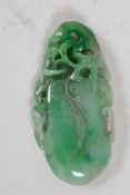 A large Chinese jade pendant, carved as a gourd, 4" long