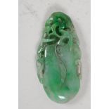 A large Chinese jade pendant, carved as a gourd, 4" long