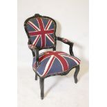 A Louis style black painted armchair upholstered in Union flag material