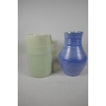 A Moorcroft blue glazed ribbed pottery vase, 10" high, and a Branham pottery vase in the form of a