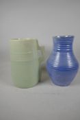 A Moorcroft blue glazed ribbed pottery vase, 10" high, and a Branham pottery vase in the form of a