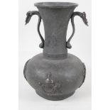 A Chinese two handled bronze vase, with bulbous base and long flared neck. With applied